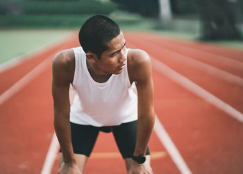 Side view of man exercising in gym