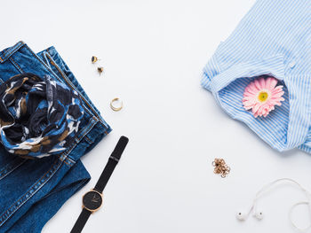 High angle view of clothing and flowers on table