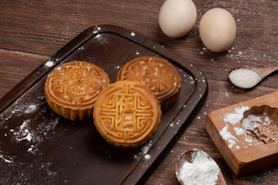 High angle view of eggs on cutting board