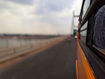 Bus on bridge against sky