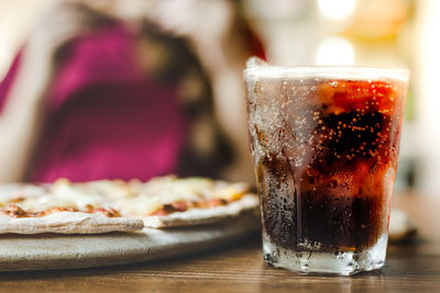 Close-up of drink in glass on table at restaurant