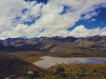 Scenic view of lake and mountains against sky