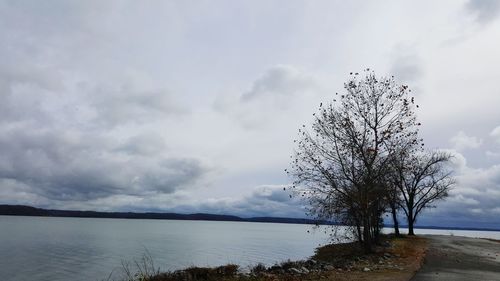 Scenic view of sea against cloudy sky