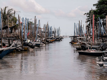 Boats moored at harbor