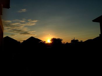 Silhouette of trees against sky at sunset
