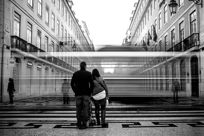 Rear view of people by moving cable car