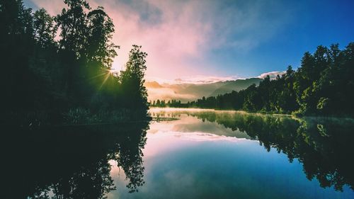 Scenic view of lake against sky during sunset