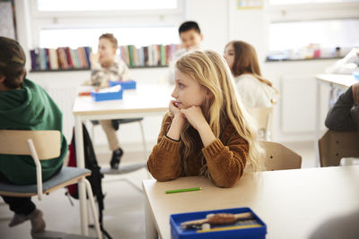 Girl sitting in classroom