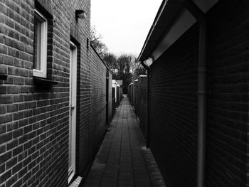 Walkway amidst buildings