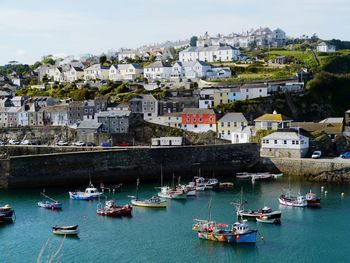 High angle view of townscape by sea against sky