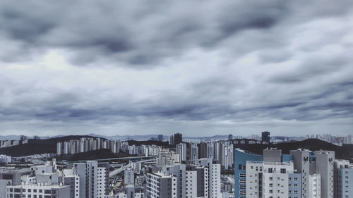 Modern buildings in city against sky