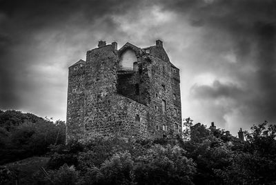 Low angle view of fort against sky
