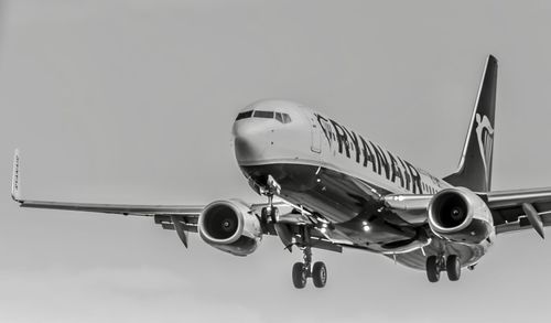 Close-up of airplane against sky