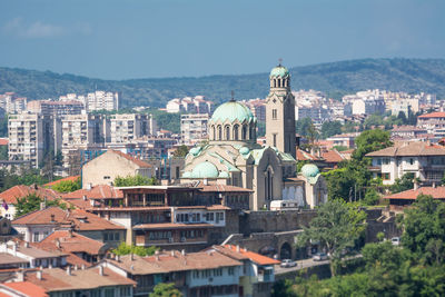 Buildings in city against sky