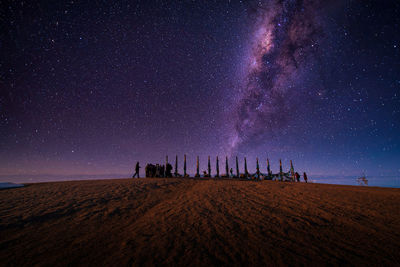 Scenic view of land against sky at night