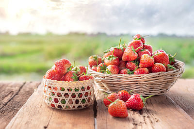 Close-up of strawberries in basket on table