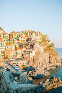 Panoramic view of sea and buildings against clear sky