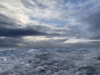 Scenic view of sea against sky during winter