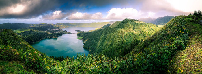 Panoramic view of plants and mountains against sky