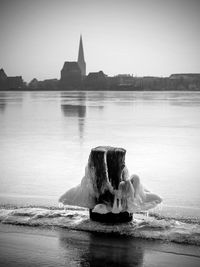 Frozen cleat on pier over lake