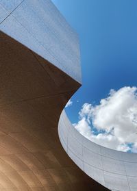 Low angle view of building against cloudy sky