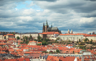 Houses in city against sky