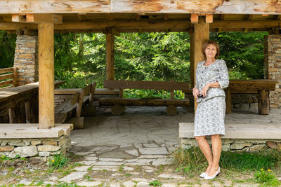 Portrait of a smiling woman standing outdoors