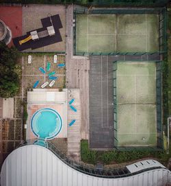 High angle view of swimming pool by building in city