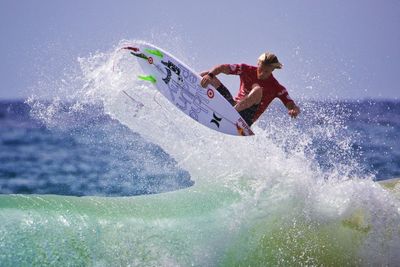 People surfing in sea