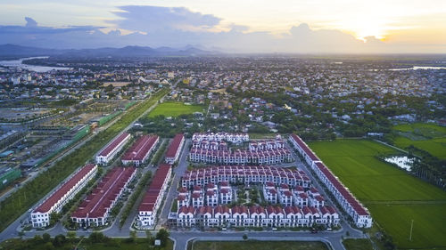 High angle view of city buildings against sky