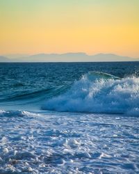 Scenic view of sea against clear sky during sunset