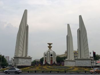 Low angle view of monument against sky in city