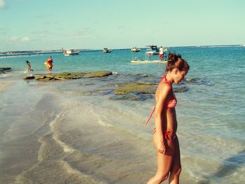 Woman standing on beach