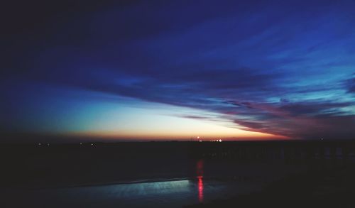 Scenic view of sea against dramatic sky