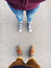 Low section of people standing on road