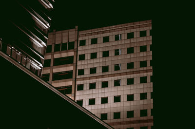 Low angle view of building against sky at night