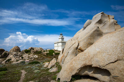 Low angle view of rock formations against sky