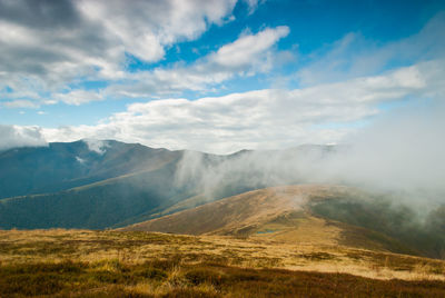 View of landscape against cloudy sky