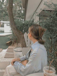 Side view of a woman drinking glass