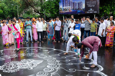 People standing on street in city