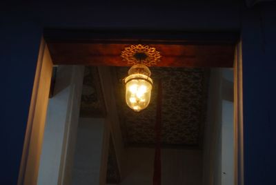 Low angle view of illuminated electric lamp