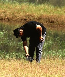 Full length of man standing on field