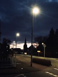 Illuminated street lights at night