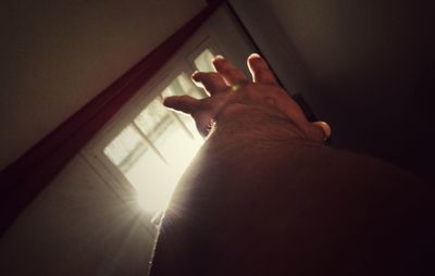 Low angle view of human hand