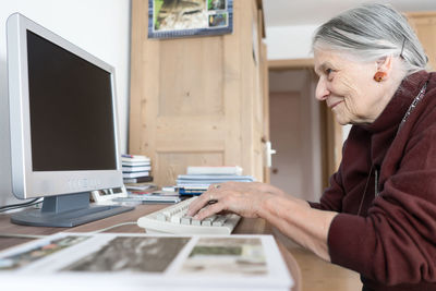 Senior woman using computer