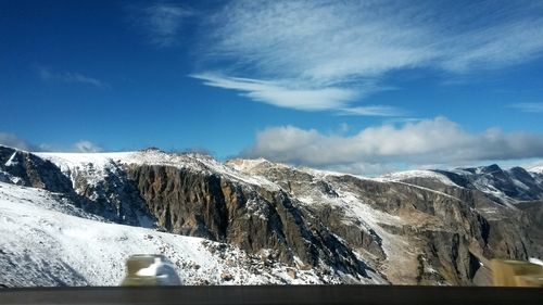 Scenic view of snow mountains against sky