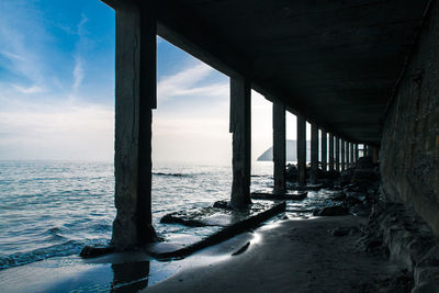 Pier on sea against sky