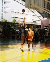 Group of people playing basketball