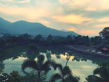 Scenic view of lake against sky during sunset