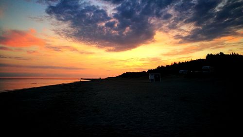 Scenic view of sea against orange sky